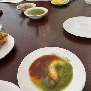 Mixing chutney and tamarind sauce together for a unique flavor.