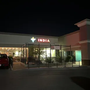 a car parked in front of a restaurant