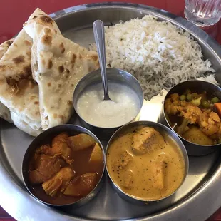 2 meat options: Chicken Tikka Masala, Chicken Vindaloo 1 veggie option: Mixed vegetables. Comes with fresh naan, rice and a rice pudding.