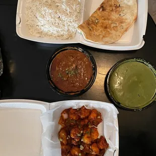 Bottom to the left Golbi Manchurian (spicy fried cauliflower) Lamb Rogan  White rice Garlic naan Saag paneer