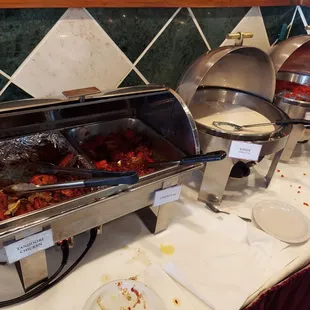 a buffet with a variety of food items