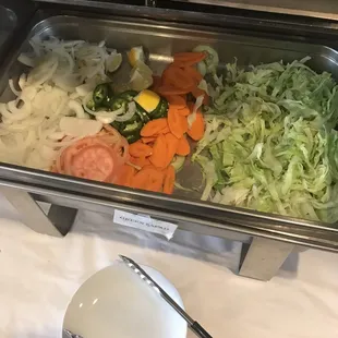 a variety of vegetables in a buffet