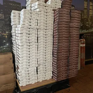 a stack of pizza boxes