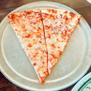 Single slice of pizza cut in half for lunch special
