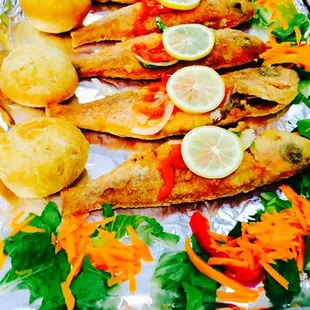 a tray of fish and vegetables