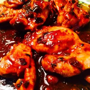 a plate of chicken with sauce