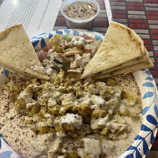 Chicken Shawarma bowl with a side of garlic sauce
