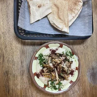 a plate of food and pita bread