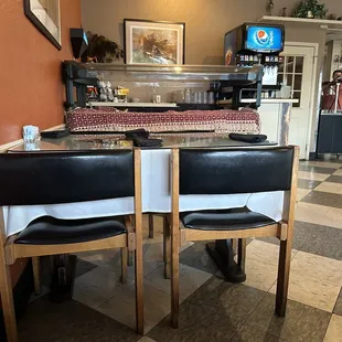 a table and chairs in a restaurant
