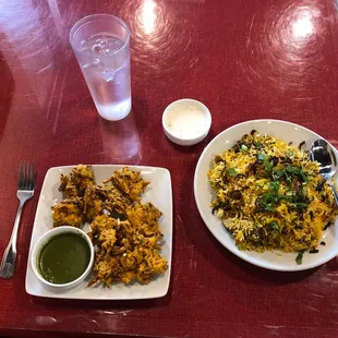 two plates of food on a red table