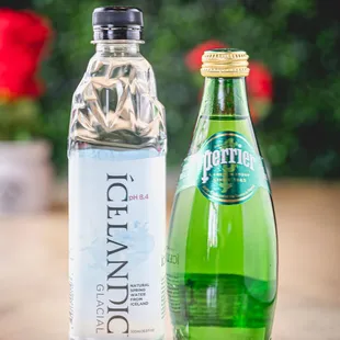 a bottle of water and a bottle of tonic