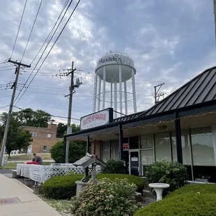 a restaurant with a water tower in the background