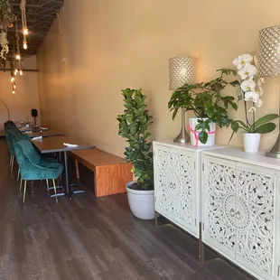 a dining room with a table and chairs
