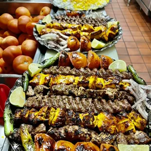 Filet Mignon, chicken thigh kabob, chicken breast kabob, ground beef kabob (koobideh ), grilled tomatoes, basmati saffron rice