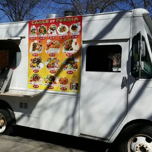 a man ordering food from a food truck