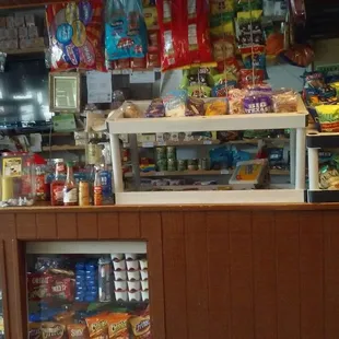 a food counter with snacks and drinks