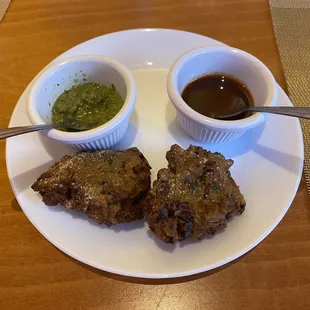 Vegetable Samosa. A Tamarind Chutney and a Mint Cilantro Chutney.