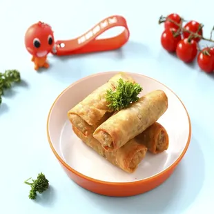 a plate of vegetable spring rolls