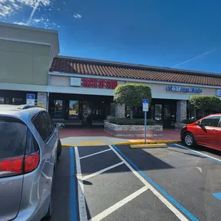 a red car parked in a parking lot