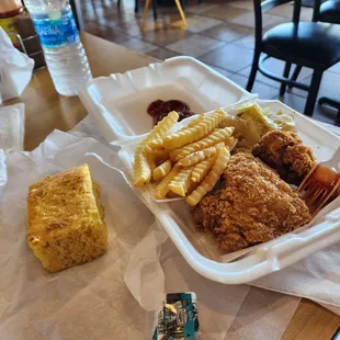 Dark fried chicken special with cabbage and fries ($9.85) add cornbread for $1.15