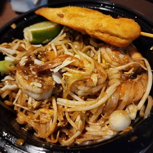 T.O.T. To-Go: Chicken satay and shrimp Pad Thai.