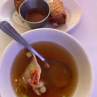 a bowl of soup and a sandwich