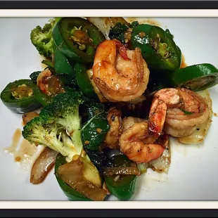 shrimp and broccoli on a white plate
