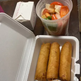 Chicken Egg Rolls and Shrimp pad preview wan with a side of steamed rice