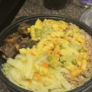 This is the Oxtail Stew &amp; Rasta Pasta Rice &amp; Beans Side order with "extra oxtail"
