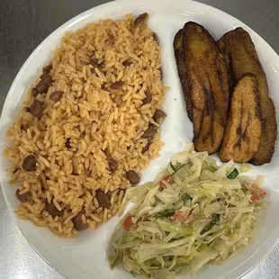 Rice and beans, steamed cabbage and fried ripe plaintain