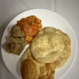 Breakfast plate: fried bake, fried potatoes, tomato chops