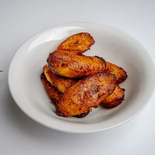 a bowl of fried bananas