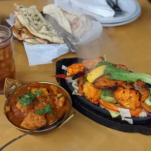 Chicken Kadai (small bowl on the left) i,Plain  Nann and naan with garlic and cilantro, iced tea and sampler entree (forgot name)