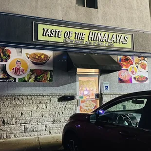 a car parked in front of a restaurant