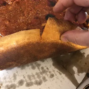 This is one poorly cut pizza, didn't come close to slicing through the crust. Hard to pull slices apart in a hotel room with no knife.