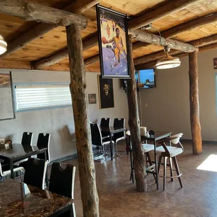 a dining area with tables and chairs