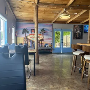 Inside the front door.  Lots of seating behind me but patrons sitting there