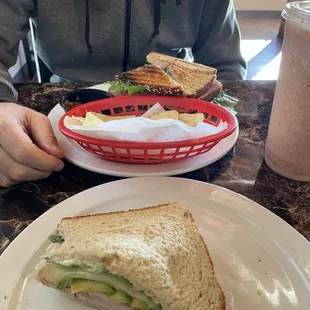 Avocado Toast /1/2 left) Club sandwich both with chips &amp; salsa.