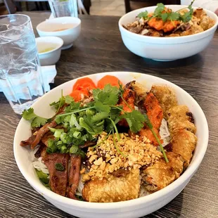 Vermicelli rice noodles with combination meats and egg roll. (Bún)