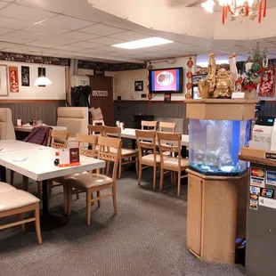 a dining room with a fish tank