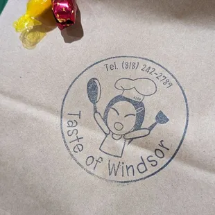 Cute logo + candy taped on my to go order of sticky rice