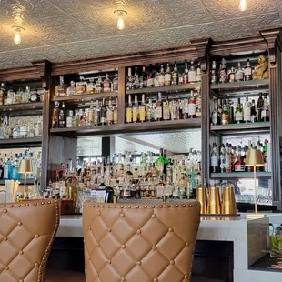 a bar with leather chairs