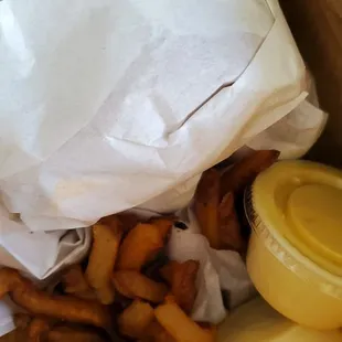 Cheeseburgers, fries, and tastee sauce