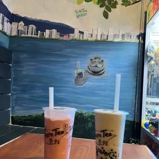 Blended strawberry milk tea and blended honeydew milk tea with tapioca balls