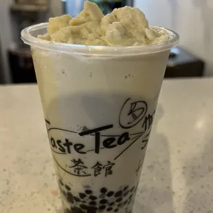 Blended honeydew milk tea with tapioca balls