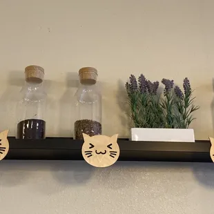 three bottles with cats on them