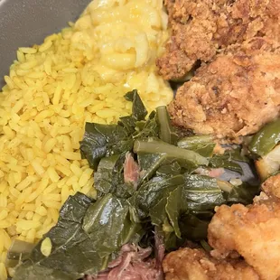Yellow rice, baked macaroni and cheese, writing, chicken wing, collard greens.