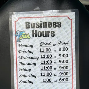 a business hours sign