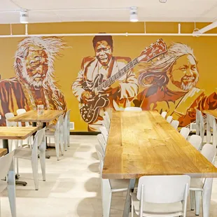 a dining area with tables and chairs