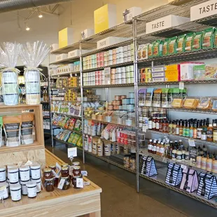 a grocery store with shelves of food and condiments